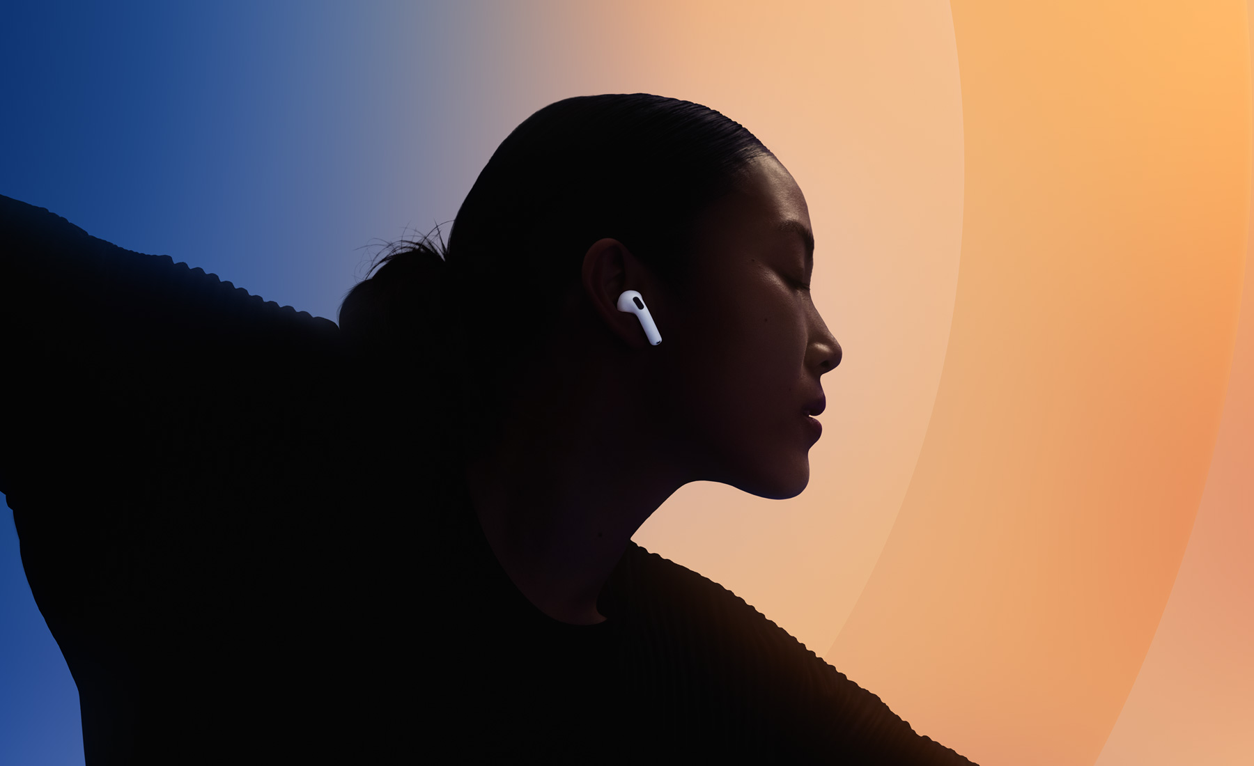 Person wearing Apple AirPods 4 during workout - sweat-resistant wireless earbuds for gym and exercise